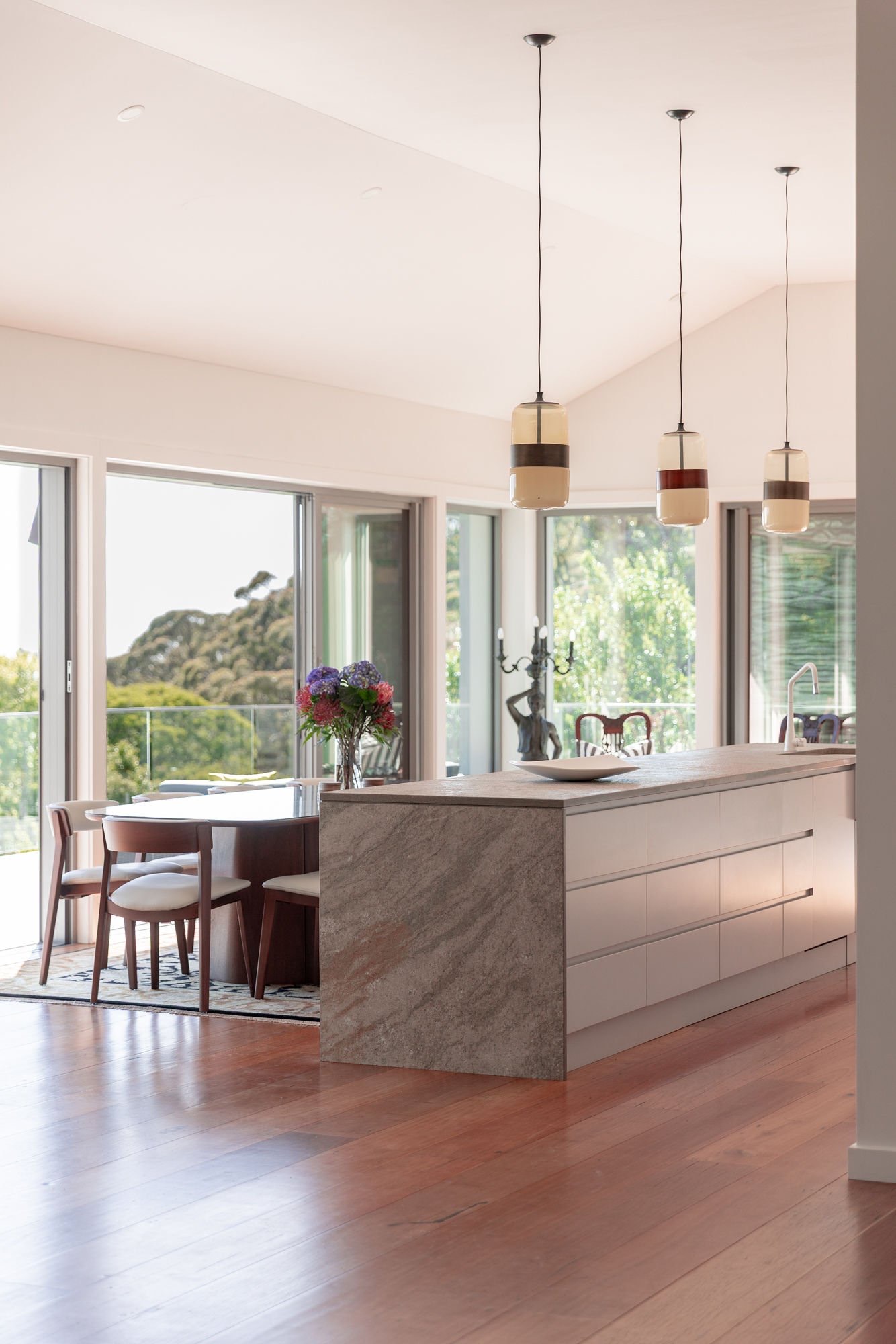 A marble kitchen island set for a private dinner.