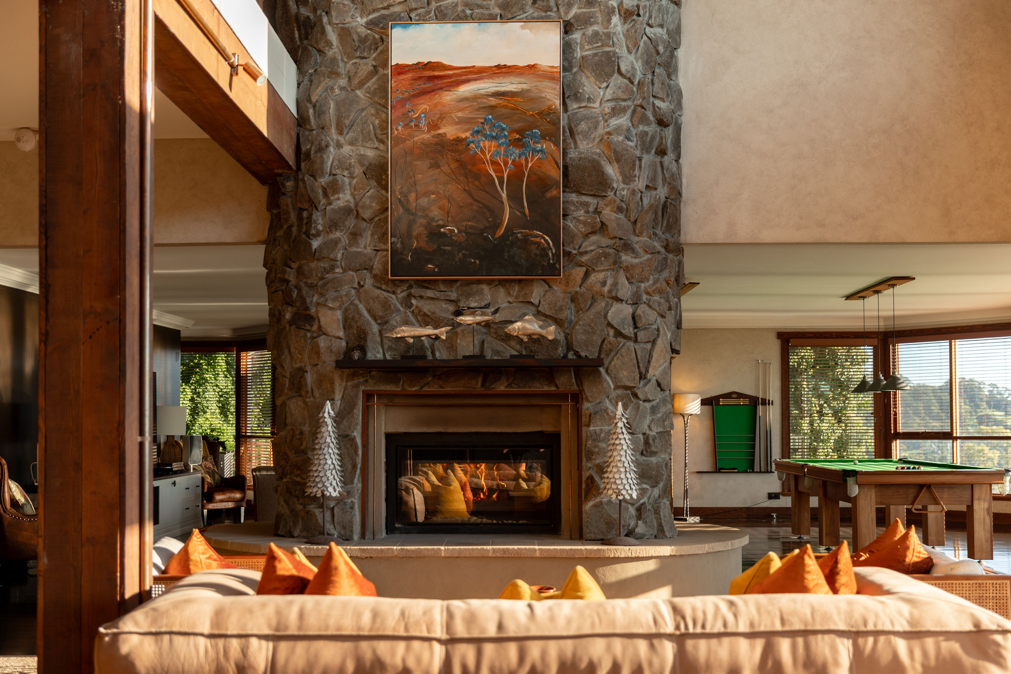 The stone fireplace and lounge at Wildefell Estate.